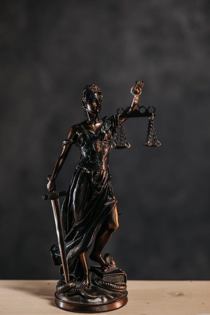 Close-up Photo of a Lady Justice Statuette 